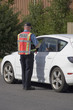 Photo: Police officer issuing speeding ticket Police officer issuing speeding ticket