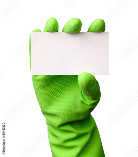 Photo: Hand in green glove showing business card Hand in green glove showing business card