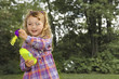Young girl blowing soap bubbles Young girl blowing soap bubbles