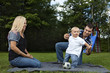 Young family playing at a park Young family playing at a park