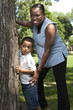 Foto: Mother and son playing hide and seek at a park Mother and son playing hide and seek at a park