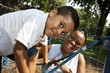 Mother and son playing at a park Mother and son playing at a park