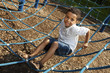 Young boy playing at a park Young boy playing at a park