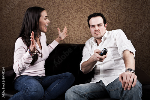 Photo: Couch potato and angry wife Couch potato and angry wife