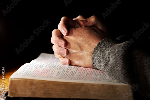 Photo: Praying Hands with Holy Bible Praying Hands with Holy Bible
