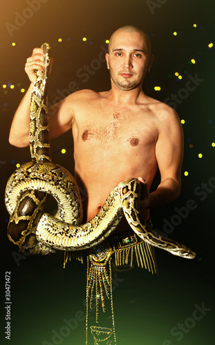 Photo: young man with a python young man with a python