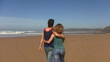Video: Couple in love walking at the beach kissing Couple in love walking at the beach kissing