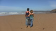 Video: Couple in love walking at the beach Couple in love walking at the beach