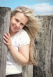 Foto: Young smiling woman at the beach Young smiling woman at the beach
