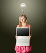 femaile in pink with open laptop
