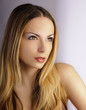Beautiful young woman staring intensely at something