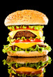 Tasty and appetizing hamburger on a dark Tasty and appetizing hamburger on a dark