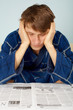 Sad man reading a newspaper
