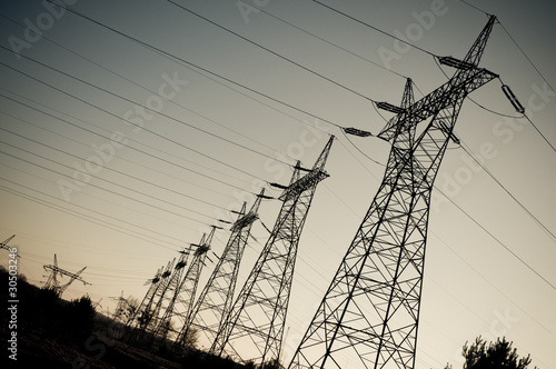 Photo: Pylon and transmission power line in sunset Pylon and transmission power line in sunset