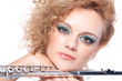 Portrait of a woman playing flute Portrait of a woman playing flute