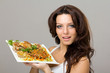 smiling young woman posing with a meal