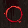 Vector bloody round frame on black wood texture background
