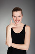 beautiful woman making a call me gesture