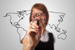 businesswoman drawing the world map in a whiteboard