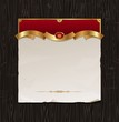 Vintage golden frame with paper banner on wood backgraund