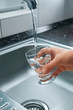Pouring fresh tap water into a glass