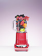 Variety of fruit crammed in blender