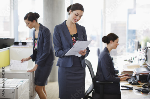 Photo: Sequence of businesswoman working in office Sequence of businesswoman working in office