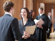 Foto: Lawyers talking in corridor Lawyers talking in corridor