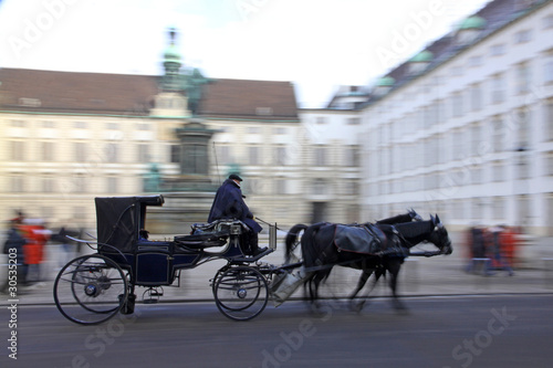 Photo: Horse-driven carriage at Hofburg palace, Vienna, Austria Horse-driven carriage at Hofburg palace, Vienna, Austria