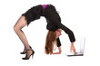 Photo: Girl in black suit doing bridge and working on notebook. Girl in black suit doing bridge and working on notebook.