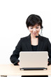 asian business operator using laptop computer