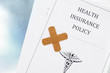 health insurance policy with bandage, shot from above