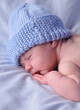 Newborn Baby Sleeping on Blue Newborn Baby Sleeping on Blue