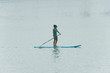 woman paddle surfing