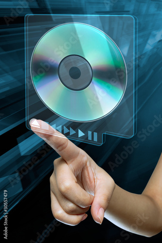 Photo: a woman hand press the option eject cd or dvd a woman hand press the option eject cd or dvd