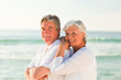 Woman hugging her husband at the beach