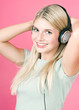 Beautiful blonde girl listening to music