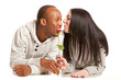 Young couple, about to kiss over a red rose ?