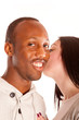 Whispering something that pleases him