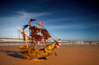 Ship model on summer sunny beach
