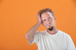 Man With Hand on Head