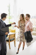 Realtor handing couple keys to home