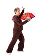 Photo: Senior woman doing Tai Chi Yoga exercise Senior woman doing Tai Chi Yoga exercise