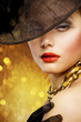 Beautiful Woman over luxury gold background