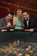 Excited friends winning at craps table