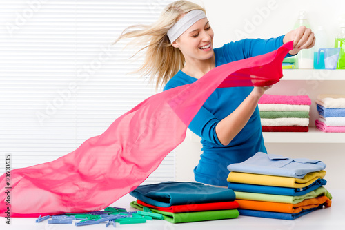 Photo: Laundry - woman folding clothes Laundry - woman folding clothes