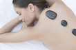 Foto: Woman enjoying Lastone therapy massage Woman enjoying Lastone therapy massage
