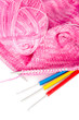 Handmade needle knitted pink canvas, yarn ball and hooks