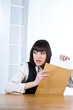 Curious woman reading a letter
