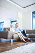 Smiling couple sitting on couch